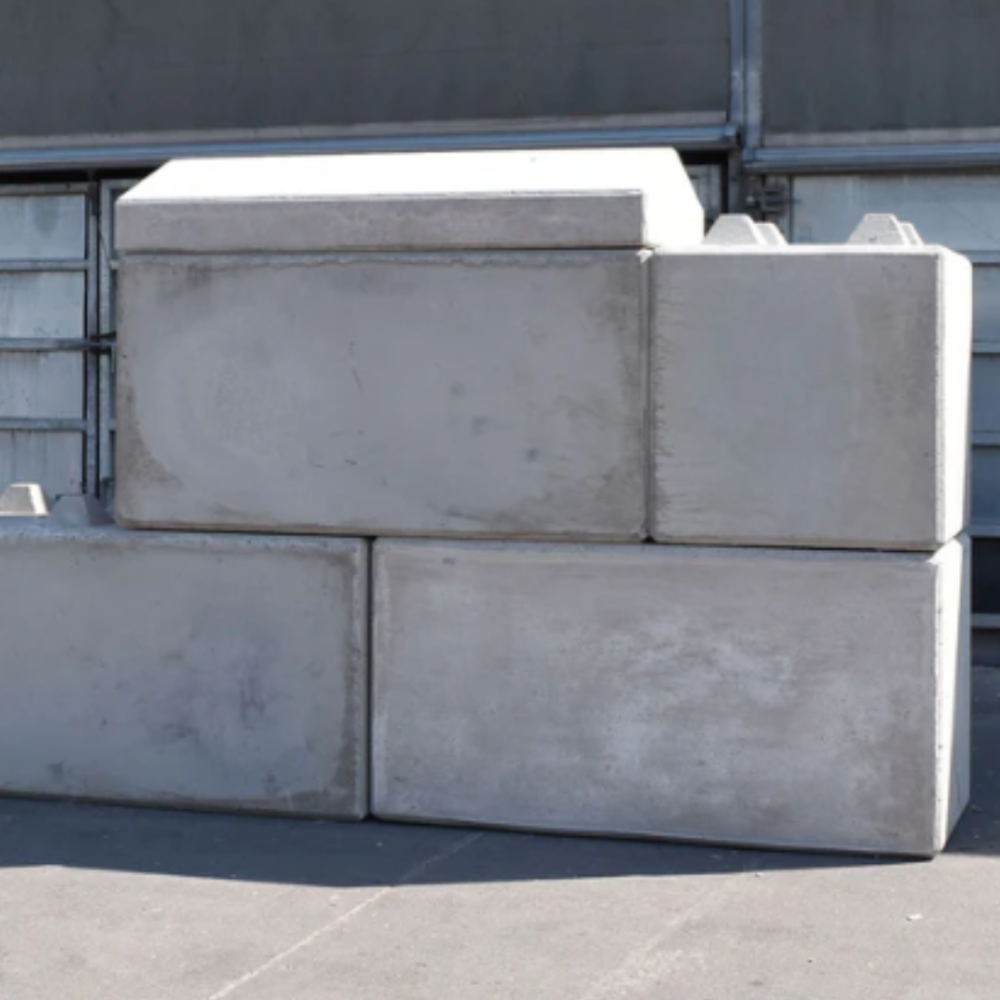 A pile of cwp precast concrete interlocking blocks including a coping stone on the top