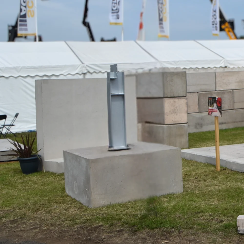 Flat-top  precast concrete foundation bases with a steel beam bolted to the top - suitable for a number of applications including building foundations, camera bases and lampposts. 