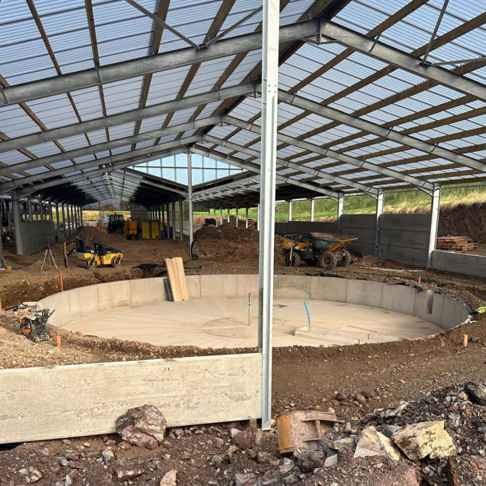 Far away view of the complete precast rotary parlour setup, under a steel-framed building.