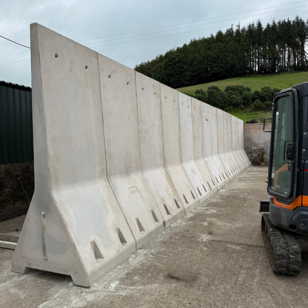 Freestanding A walls forming silage pit walls. these are fixed down to make them suitable for silage.