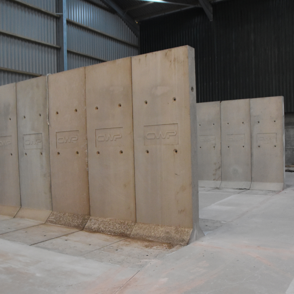 Precast T walls positioned to form storage bays